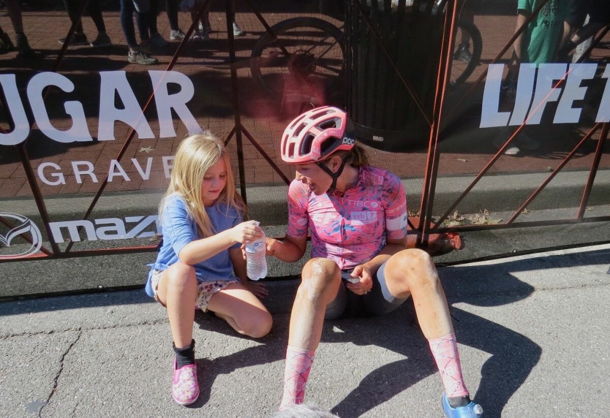 Emily Newsom celebrates a second-place finish at 2022 Big Sugar Gravel with her seven-year-old daughter