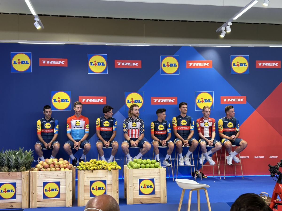 Lidl-Trek riders on stage showing off their new kit