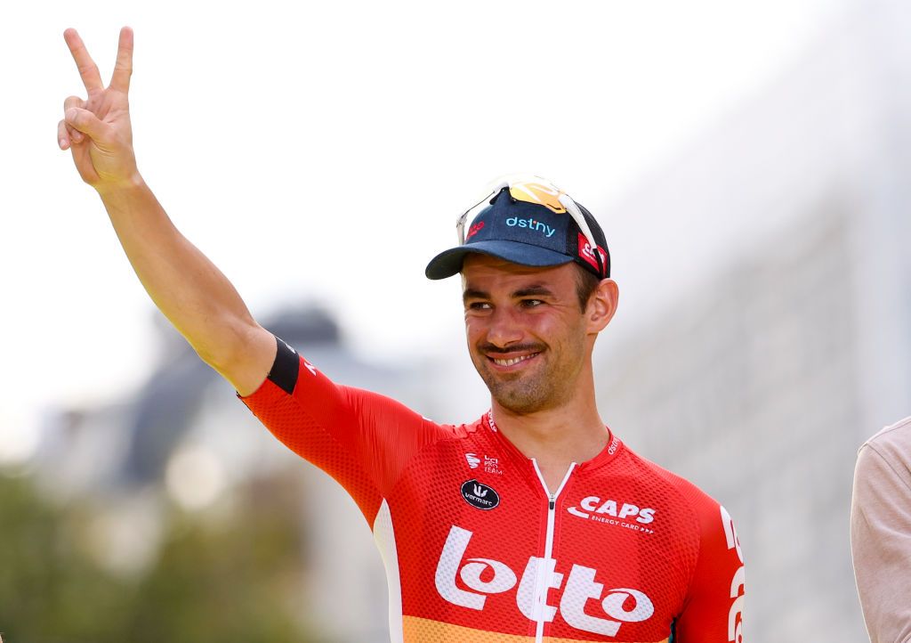 Victor Campenaerts celebrates his Tour de France super-combativity prize in Paris